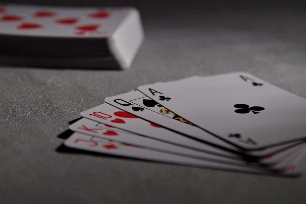 Playing cards on a casino table games felt